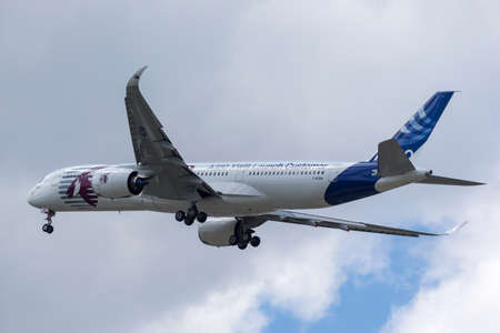 Farnborough, UK - July 16, 2014: Airbus A350-941 commercial aircraft with a hybrid Airbus/Qatar...