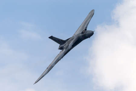 Farnborough, UK - July 21, 2014: Former Royal Air Force (RAF) Avro Vulcan B.2 bomber aircraft XH558 operated by the Vulcan to the Sky Trust.のeditorial素材