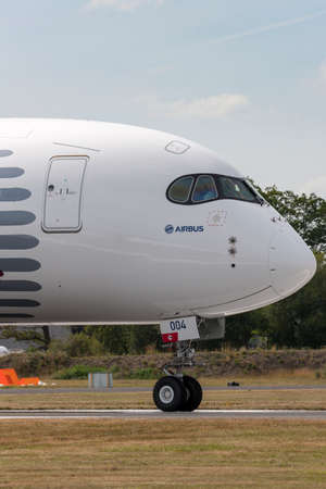 Farnborough, UK - July 18, 2014:  Airbus A350-941 commercial aircraft with a hybrid Airbus/Qatar...