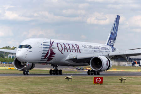 Farnborough, UK - July 16, 2014: Airbus A350-941 commercial aircraft with a hybrid Airbus/Qatar Airways livery.のeditorial素材