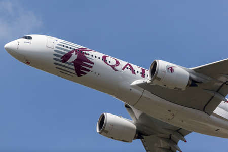 Farnborough, UK - July 18, 2014: Airbus A350-941 commercial aircraft with a hybrid Airbus/Qatar Airways livery.のeditorial素材