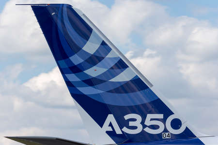 Farnborough, UK - July 16, 2014: Airbus A350-941 commercial aircraft with a hybrid Airbus/Qatar Airways livery.のeditorial素材