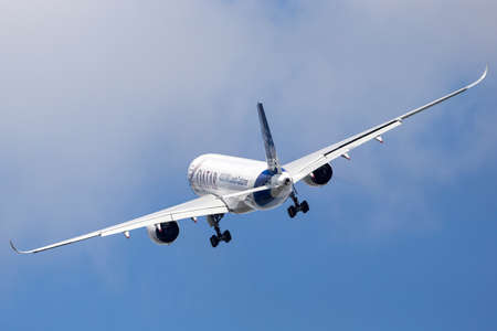 Farnborough, UK - July 16, 2014: Airbus A350-941 commercial aircraft with a hybrid Airbus/Qatar...