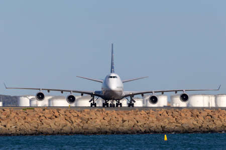 Sydney, Australia - October 10, 2013: United Airlines Boeing 747 jumbo jet airliner on the runway at Sydney Airport.のeditorial素材