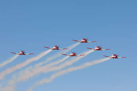 Temora, Australia - November 2, 2013: Royal Australian Air Force (RAAF) Roulettes formation aerobatic display team flying Pilatus P-9A military trainer aircraft.のeditorial素材