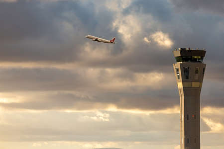 Melbourne, Australia - January 19, 2020: Melbourne Airport air traffic Control Tower at sunset with...