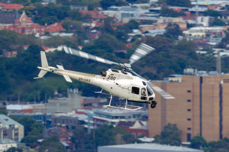 Melbourne, Australia - March 16, 2014: Eurocopter AS-350BA Helicopter conducting aerial filming with a nose mounted Cineflex camera over Melbourne.のeditorial素材