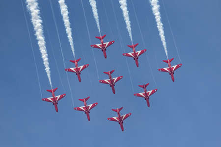 RAF Fairford, Gloucestershire, UK - July 13, 2014: Royal Air Force (RAF) Red Arrows formation aerobatic display team flying British Aerospace Hawk T.1 Jet trainer aircraft.のeditorial素材