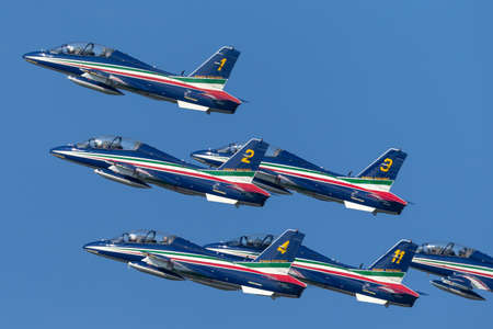Payerne, Switzerland - September 5, 2014: Frecce Tricolori formation display team of the Italian Air Force (Aeronautica Militare Italiana) flying Aermacchi MB-339PAN aircraft.のeditorial素材