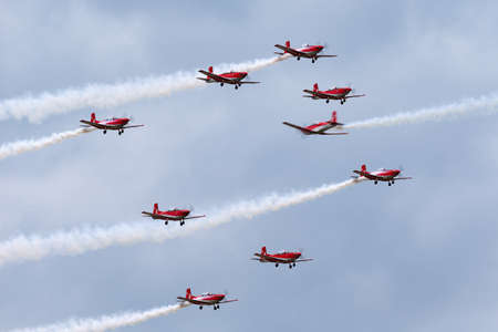 Payerne, Switzerland - August 31, 2014: Swiss Air Force PC-7 display team flying Pilatus PC-7 trainer aircraft.のeditorial素材