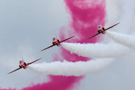 RAF Waddington, Lincolnshire, UK - July 6, 2014: Royal Air Force (RAF) Red Arrows formation...