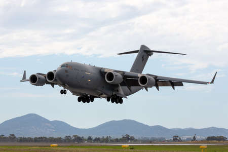Avalon, Australia - February 27, 2015: Royal Australian Air Force (RAAF) Boeing C-17A Globemaster III Large military cargo aircraft operated by 36 Squadron based at RAAF Amberley, Queensland.のeditorial素材