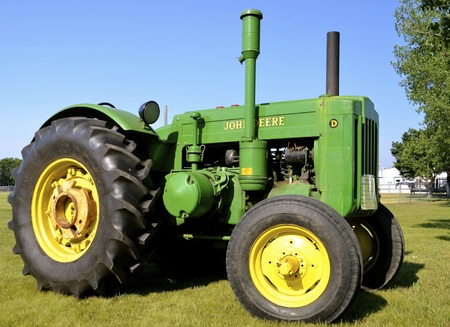 BARNESVILLE, MINNESOTA, July 10, 2015: A restored John Deere D tractor is on display at the Barnesville County Fair in July where thousands attend the annual event.のeditorial素材