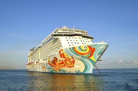 COZUMEL, MEXICO, February 16, 2016: The Norwegian Getaway anchored in the Caribbean Sea belongs to...