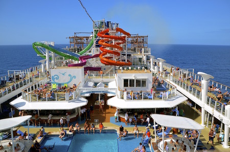 COZUMEL, MEXICO, February 16, 2016: The Norwegian Getaway anchored in the Caribbean Sea belongs to...
