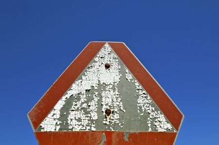 Old chipped peeling painted Slow Moving Vehicle signの写真素材