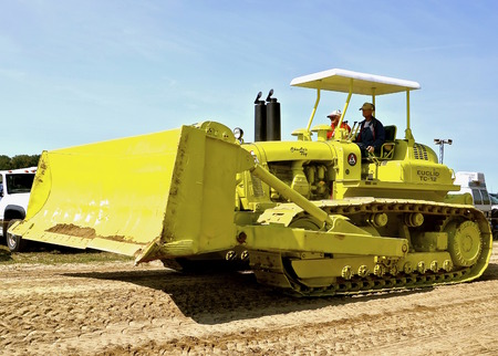 ROLLAG, MINNESOTA, Sept 1. 2016: Two unidentified men operate an old restored Euclid TC-12 bulldozer in a parade at the West Central Steam Threshers Reunion in Rollag, MN attended by 1000's held annually on Labor Day weekend.のeditorial素材