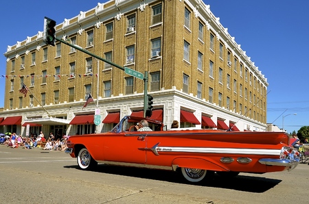 MANDAN, NORTH DAKOTA, July 3, 2016: The 4th of July Rodeo Days  3 day celebration includes the rodeo, Art in the Park, and downtown 4th parade where this red 1959 Chevrolet Impala convertible is featured.のeditorial素材