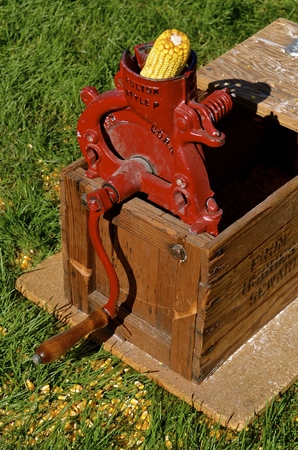 YANKTON, SOUTH DAKOTA, August 19, 2016: The Fulton Hand Crank Corn Sheller Husker Grinder in working order is displayed at the Yankton South Dakota Riverboat Days held annually each third weekend of August.のeditorial素材