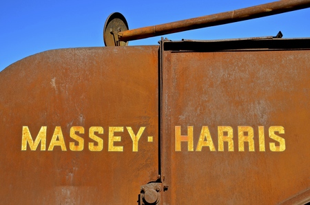 DALTON,  MINNESOTA, March 29, 2017:T he Massey Harris name on the rusty Combine  disappeared when a merger of Massey Harris and the Ferguson Company farm machinery manufacturer occurred in 1953, to become Massey Ferguson.のeditorial素材
