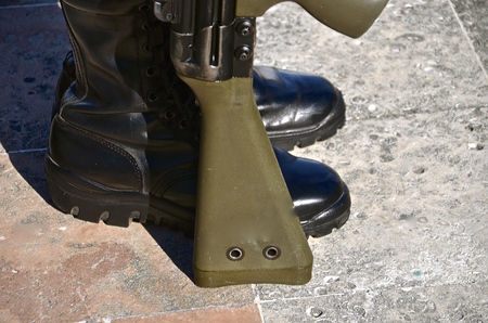 A Mexican soldier stands at attention with weapon at his side.の写真素材