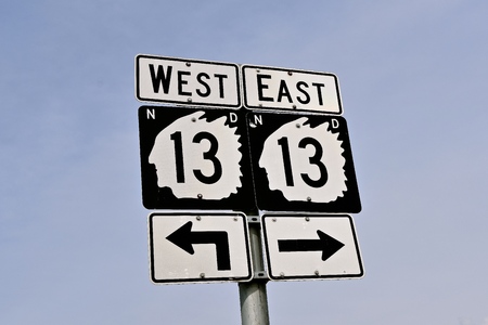 Road traffic signs in North Dakota state highway system finds route 13 in the shield and outline outline of an Indian Chiefの写真素材