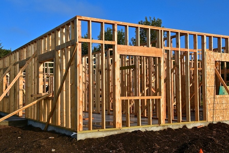 New construction of an office building being framed and built on a concrete pad.の写真素材