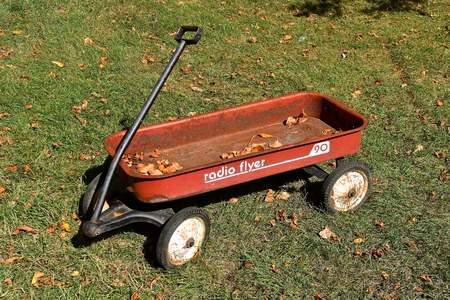 DOWNER, MINNESOTA, October 3, 2017: The retro red wagon is a Radio Flyer product which also makes tricycles, bicycles, and ride-ons and is base in Chicago, IL where it was founded in 1917のeditorial素材
