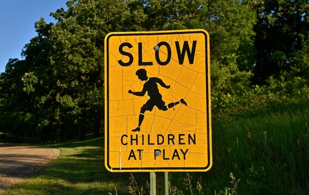 Road sign on a rural gravel road warning toの写真素材