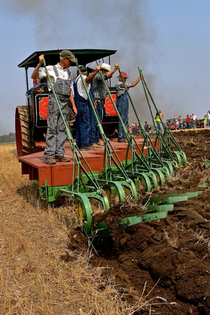 ROLLAG, MINNESOTA, Sept 2, 2017:The unidentified men are demonstrating gang plowing with a steam engine  at the annual WCSTR farm show in Rollag held each Labor Day weekend where 1000's attend.のeditorial素材