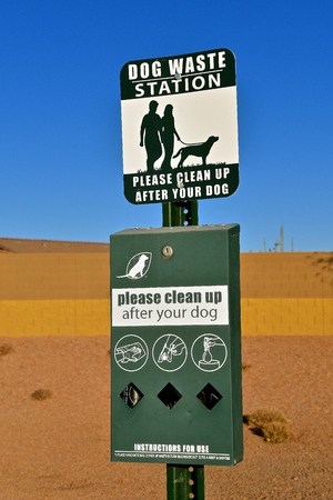 A dog waste station with signs, instructions, and materials.の写真素材