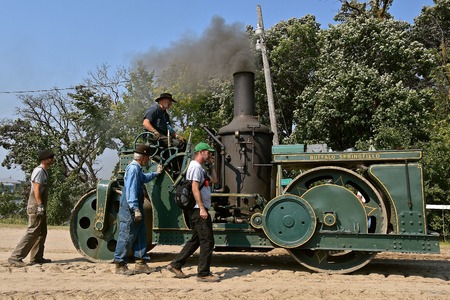 ROLLAG, MINNESOTA, Sept 2, 2017: The crew of the Buffalo Springfield steam engine participate in the  daily parade at the annual WCSTR farm show in Rollag held each Labor Day weekendのeditorial素材