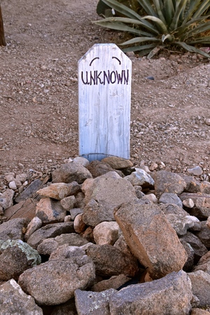 Unknown markers and graves surrounded with rocks and crosses in a cemetery known as boothillの写真素材