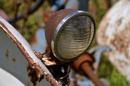 Old headlight from a vintage tractorの写真素材