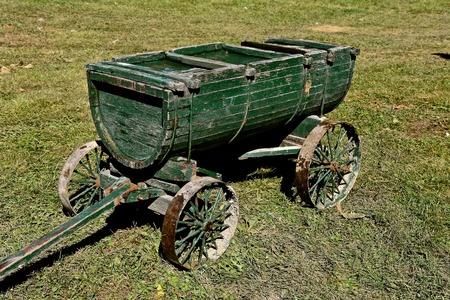 A very old and unique wood wagon for hauling water, liquid or other productsの写真素材