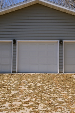 Poplar tree seeds litter a driveway in the spring seasonの写真素材