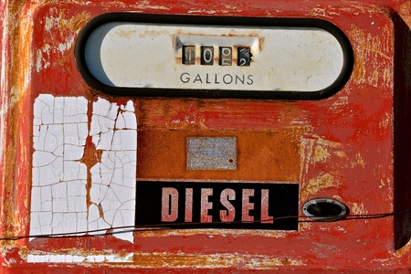 Closeup of an old faded diesel fuel pump displaying a sale of 105 gallons.の写真素材