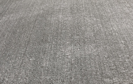 Wet concrete which has gone through the process of screening and has a slightly rough texture