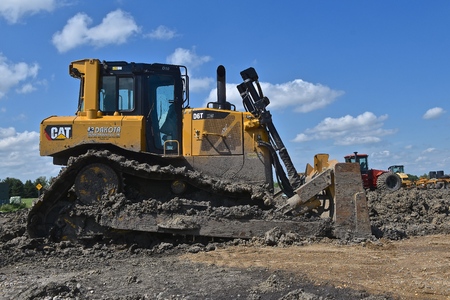 MOORHEAD, MINNESOTA, July 21, 2018: Founded in 1925, the D6T Cat bulldozer  full of mud is from Caterpillar Inc., an American corporation which designs, develops, engineers, manufactures, markets and sells machinery, engines, financial products and insuraのeditorial素材