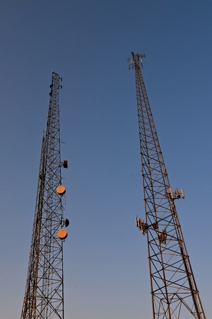 Several cell telephone and telecommunication towers reach skywardの写真素材