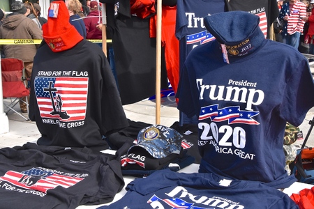 ROCHESTER, MINNESOTA, October 4, 2018:  The political t-shirts and caps for sale are displayed at the President Trump rally in Rochester in the Civic Center.のeditorial素材