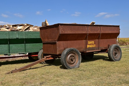 PEKIN, NORTH DAKOTA, September 2, 2018:  The antique grain wagons loaded with fire wood including an old rusty Davide Bradley wagon is displayed at the  Labor Day Stump Lake Village Threshing Bee.のeditorial素材