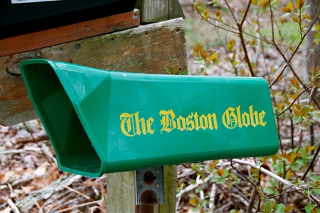 ROWLEY, MASSACHUSETTS, April 28, 2019: The green mailbox collects the daily newspaper The Globe,  an American daily newspaper founded and based in Boston, Massachusetts, since its creation by Charles H. Taylor in 1872.のeditorial素材