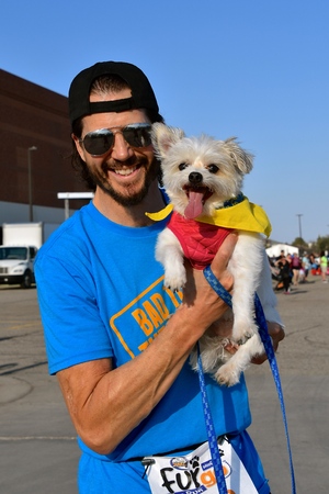 FARGO, NORTH DAKOTA-May 13, 2019 Dogs and trainers/owners participate in the Furgo Dog Race which is underway at the annual Fargo Marathon which also includes a cyclothon, youth, 5K, 10K, half, and full runs.のeditorial素材