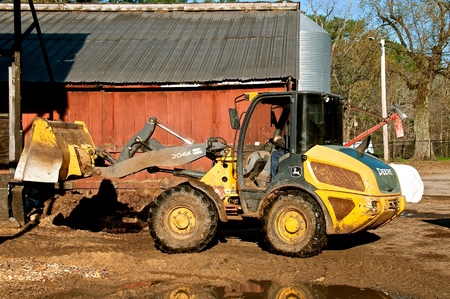ROWLEY, MASSACHUSETTS, April 28, 2019: The 204K John Deere front end loader hauling silage is a...