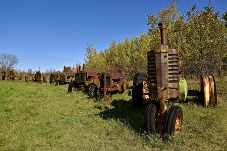 VERGAS, MINNESOTA, October 6, 2019: The row of old John Deere tractor are products of John Deere Co, an American corporation that manufactures agricultural and construction equipment, drive trains, and transmission.のeditorial素材