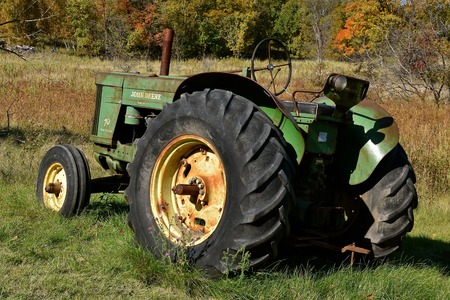VERGAS, MINNESOTA, October 6, 2019: The old John Deere 70 tractor is a  product of John Deere Co, an...