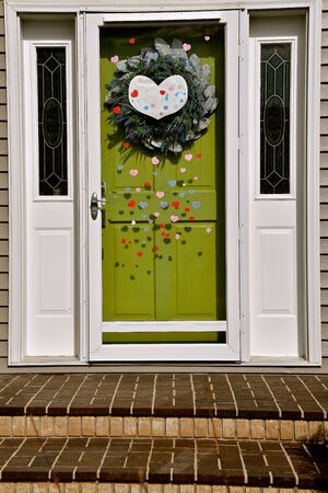 A house door is decorated with hearts