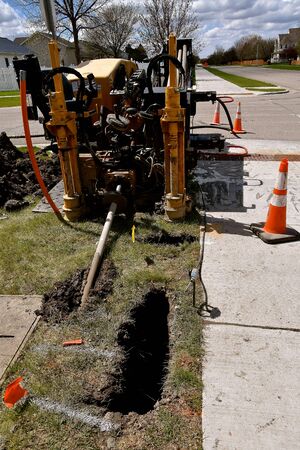 A fiber optic horizontal drilling machine for boring holes underground and running cable lines for telecommunications.の写真素材