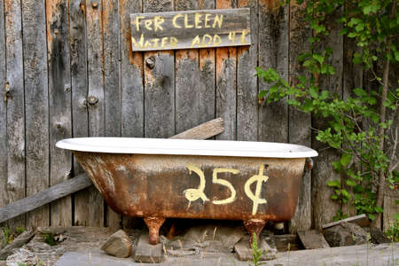 Outdoor bath with tub and water provided for only 25 centsの写真素材